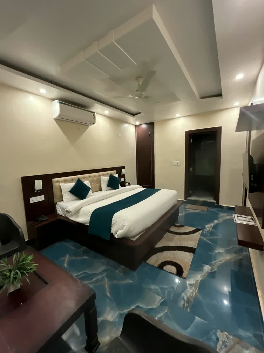 A guest room looking towards the door and the bathroom.